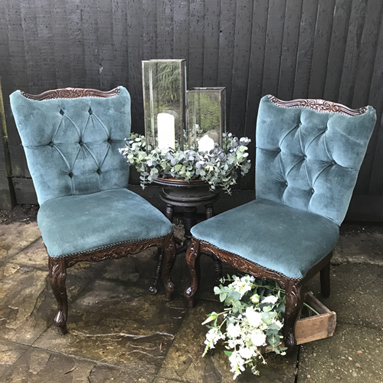 Teal velvet chairs chillout area