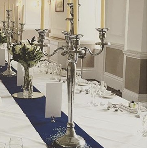 Tall silver candelabra