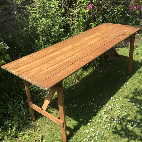 Rustic wooden vintage trestle table