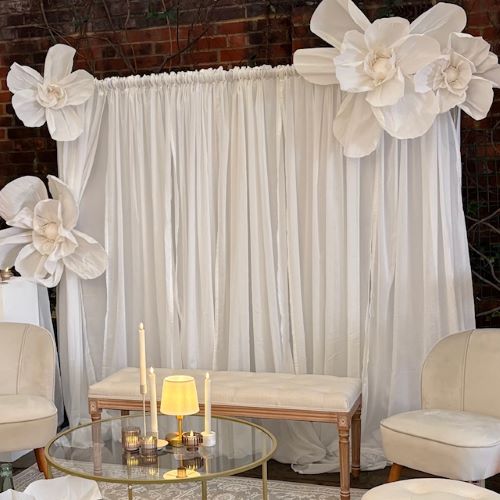 White draped backdrop